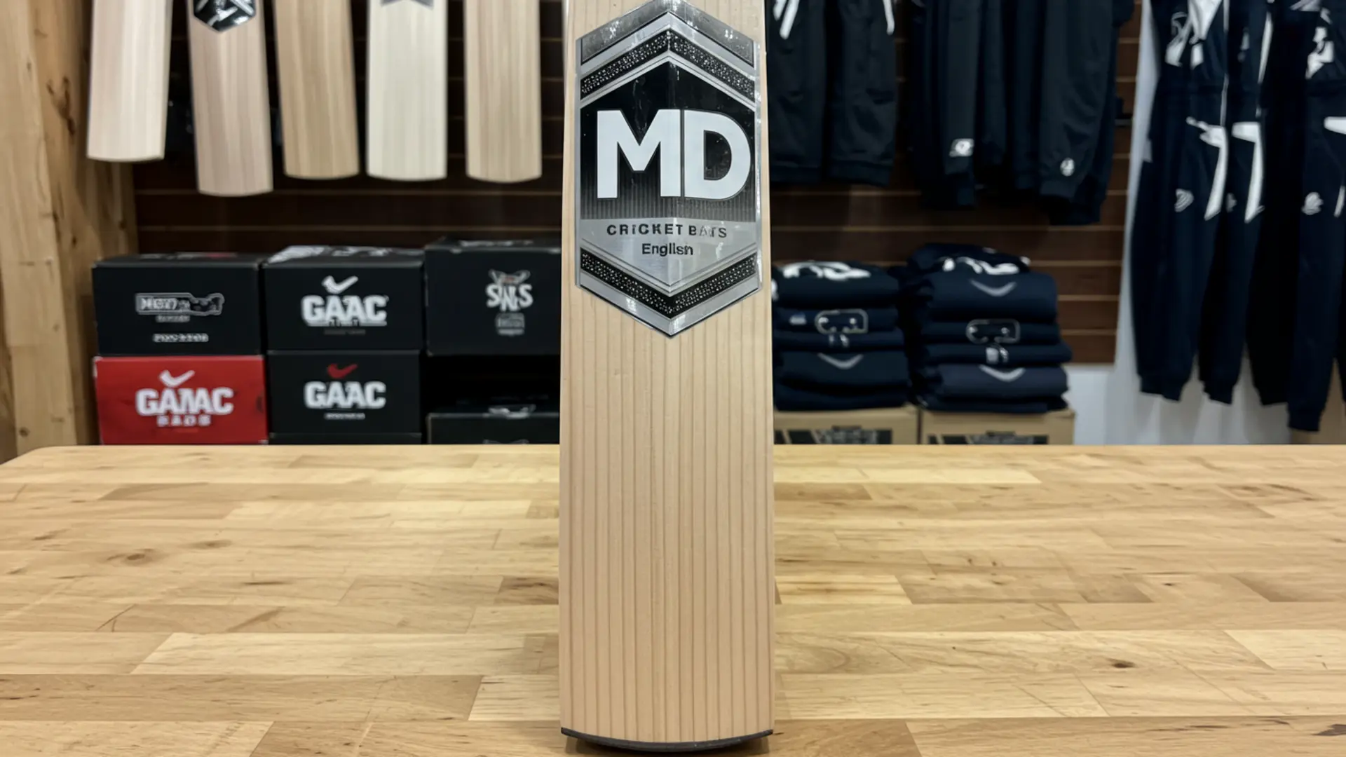 Custom English Willow bat by MD Cricket Bats in a showroom